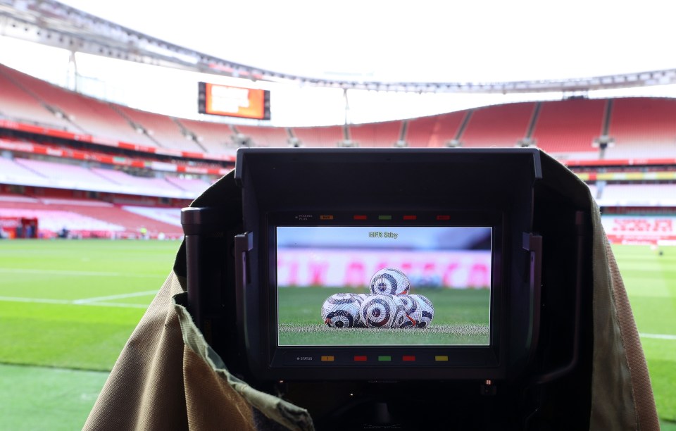 TV camera view of empty soccer stadium.