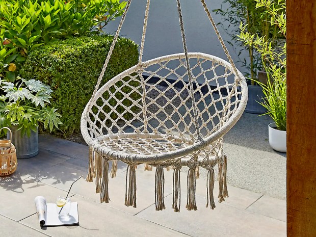 Macrame garden swing chair with tassels.