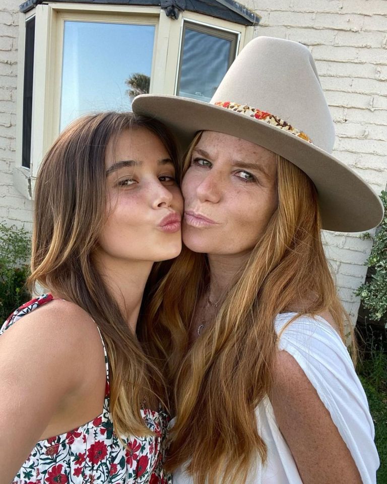 Patsy Palmer and her daughter kissing for a selfie.