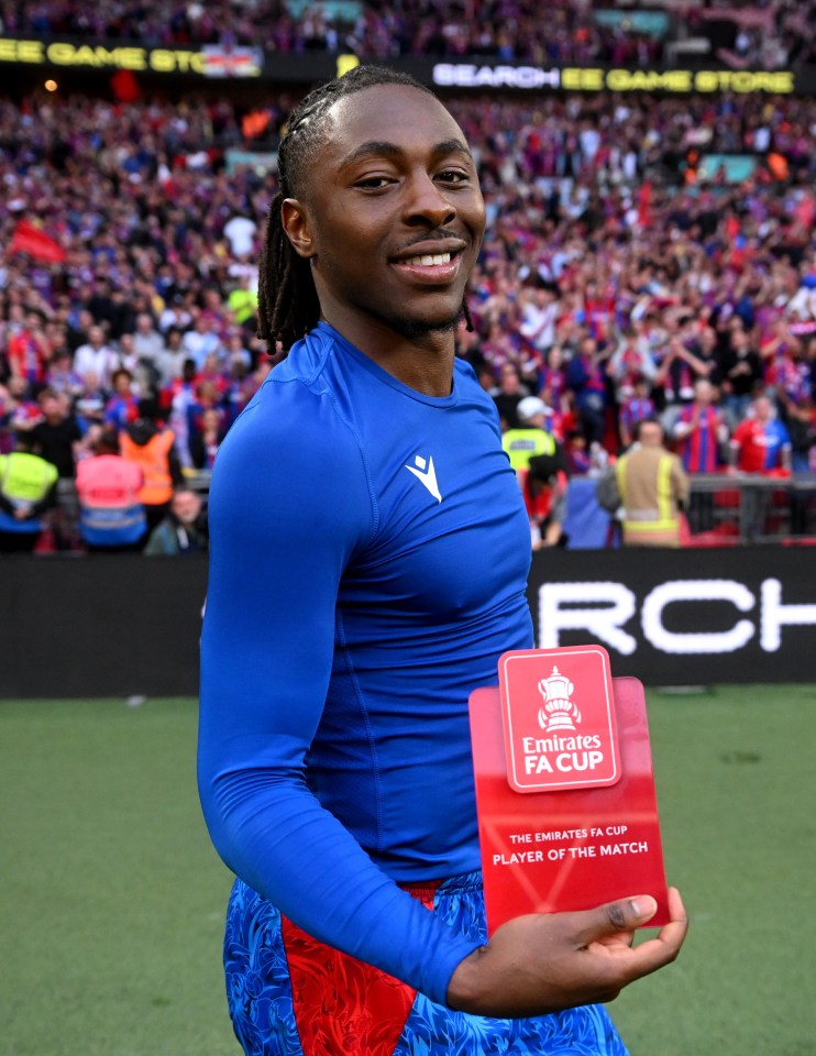 Eberechi Eze of Crystal Palace holding the Emirates FA Cup Player of the Match trophy.