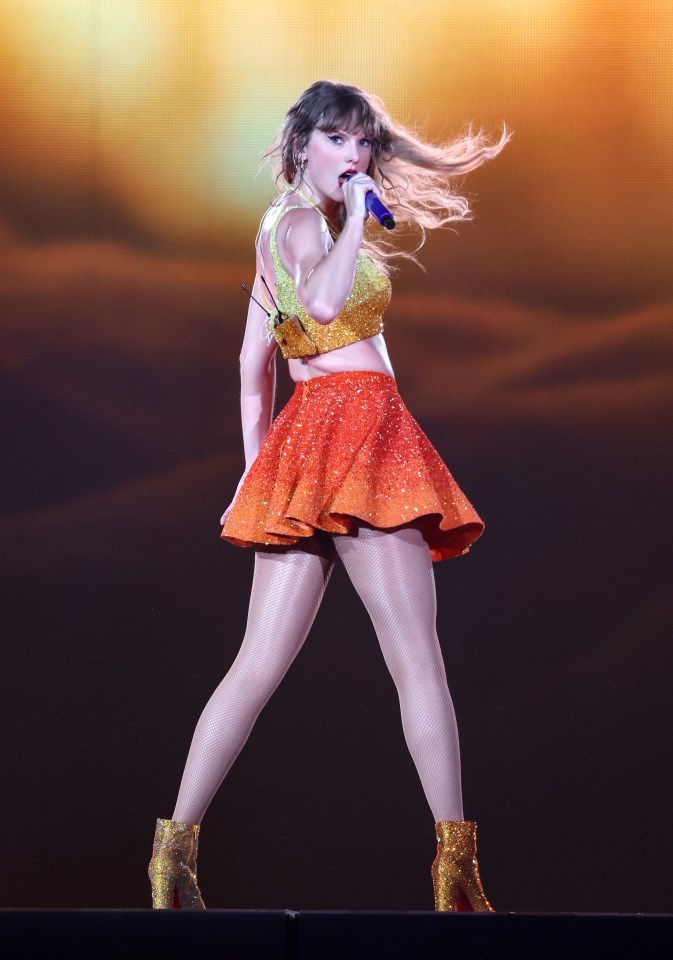 Taylor Swift performing on stage.