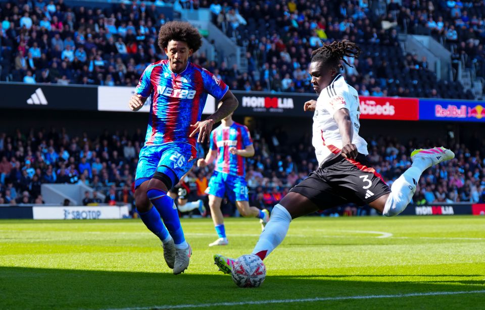 Soccer players vying for the ball.