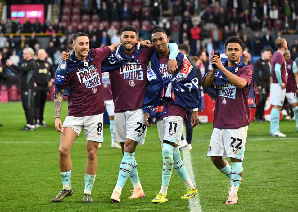Burnley football players celebrating promotion to the Premier League.