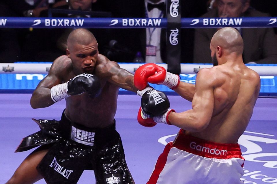 Conor Benn throwing a jab at Chris Eubank Jr during a boxing match.