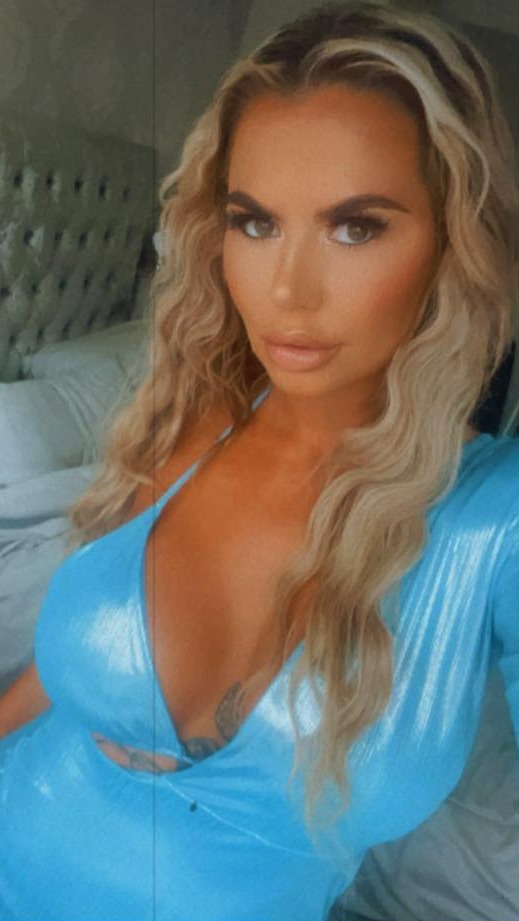 Coleen Campbell, wearing a light blue dress.