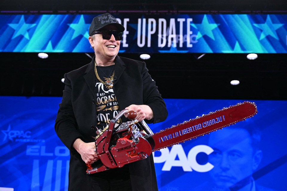 Elon Musk holding a chainsaw at CPAC.
