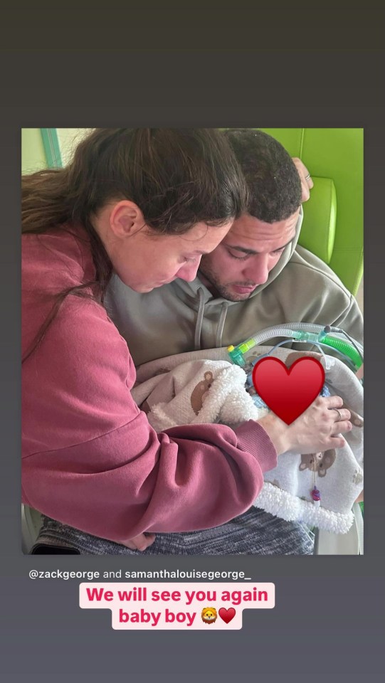 Parents holding their deceased infant son.
