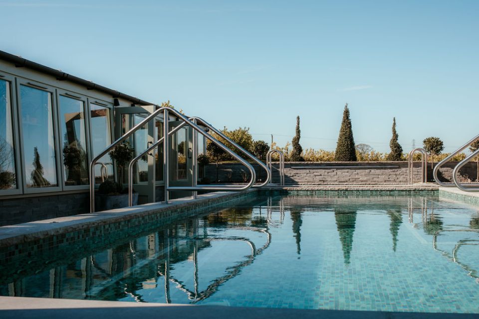 Outdoor pool at a hotel spa.