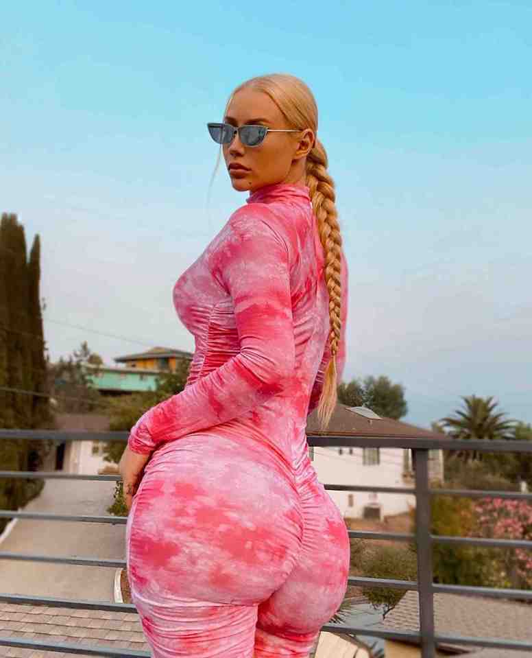 Iggy Azalea in a pink tie-dye jumpsuit.