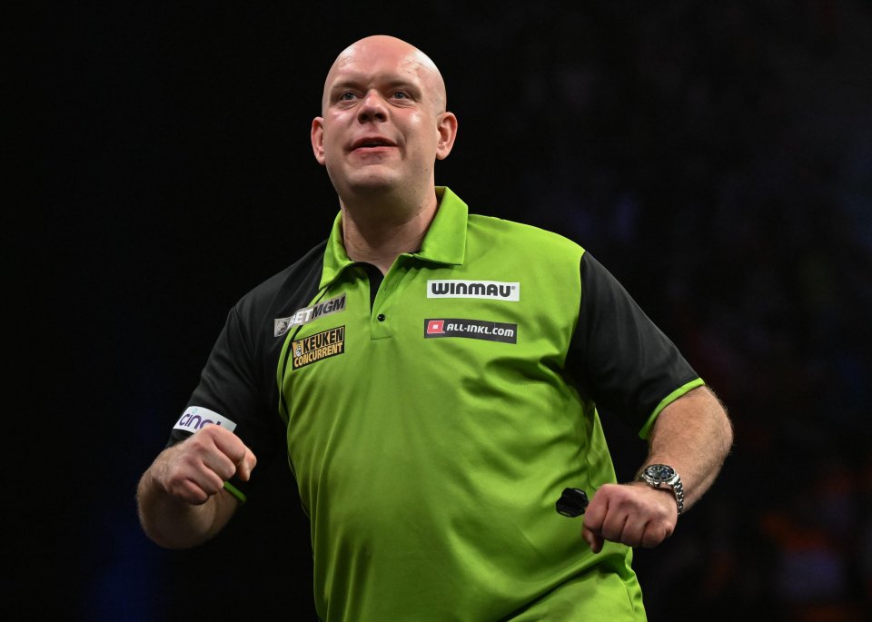 Michael van Gerwen celebrating at a darts match.