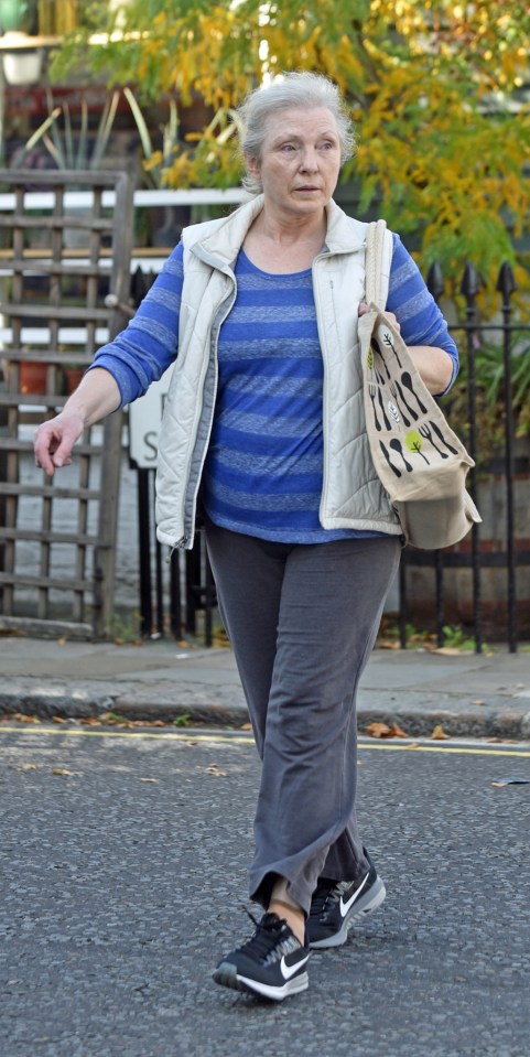 Mary Austin walking down a street.