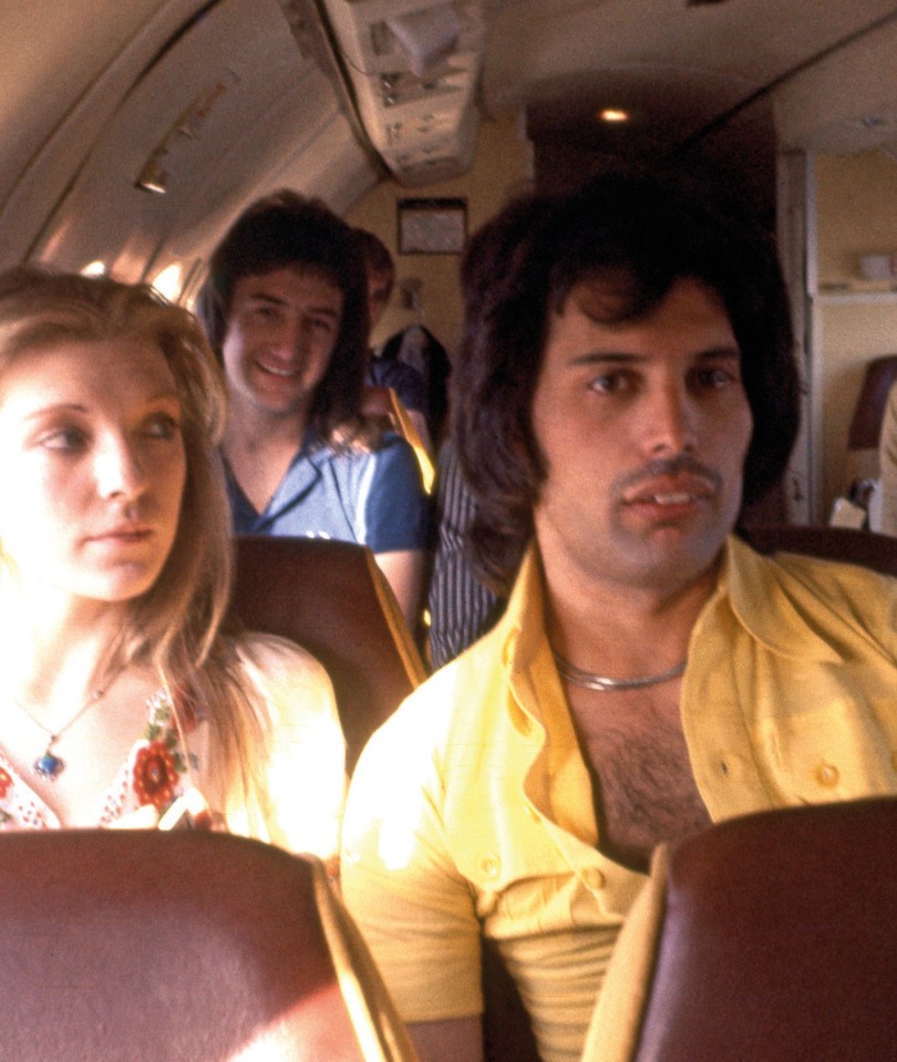 Freddie Mercury and bandmates on a plane.