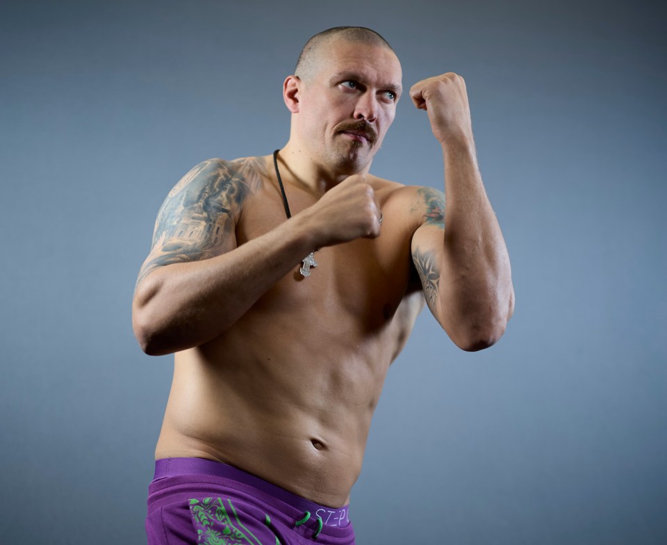 Oleksandr Usyk at a media day, in a boxing stance.
