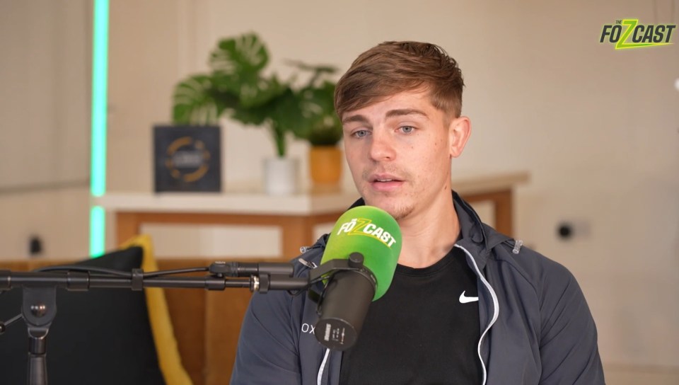 Screenshot of a computer screen showing a man on a podcast and a news article about a soccer player.