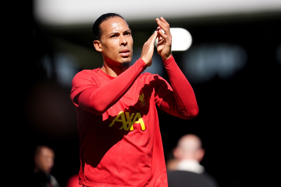 Virgil van Dijk in Liverpool training gear applauding.