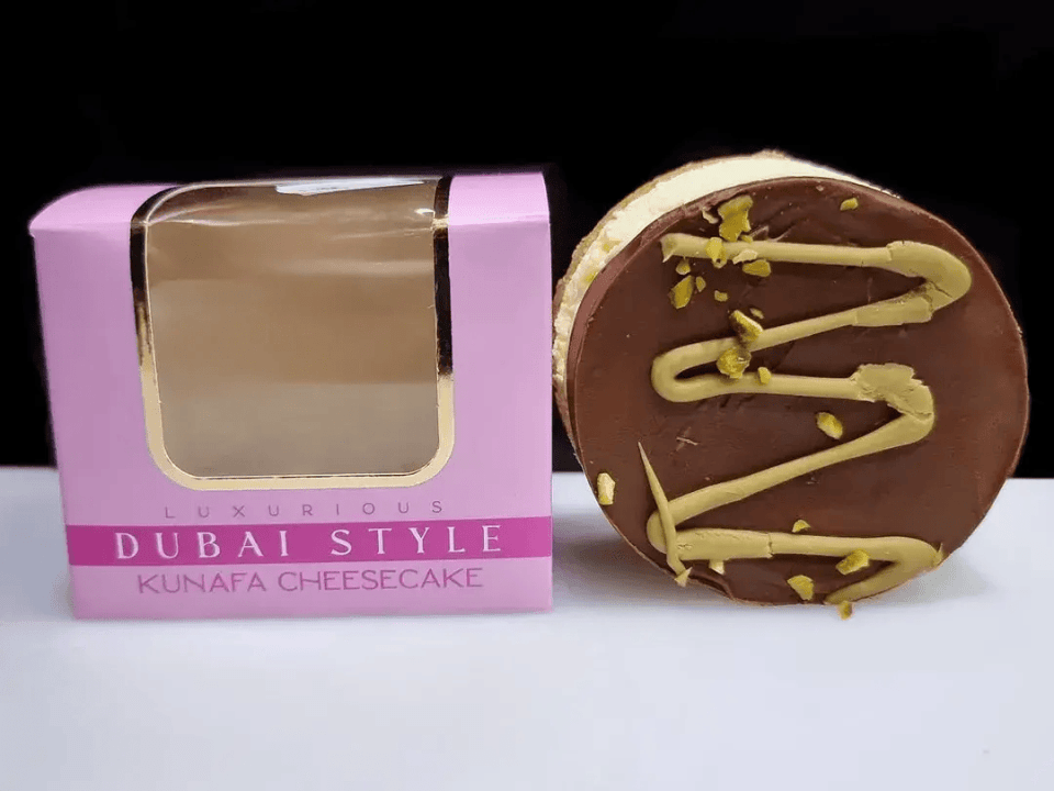 Dubai-style kunafa cheesecake in a pink box.