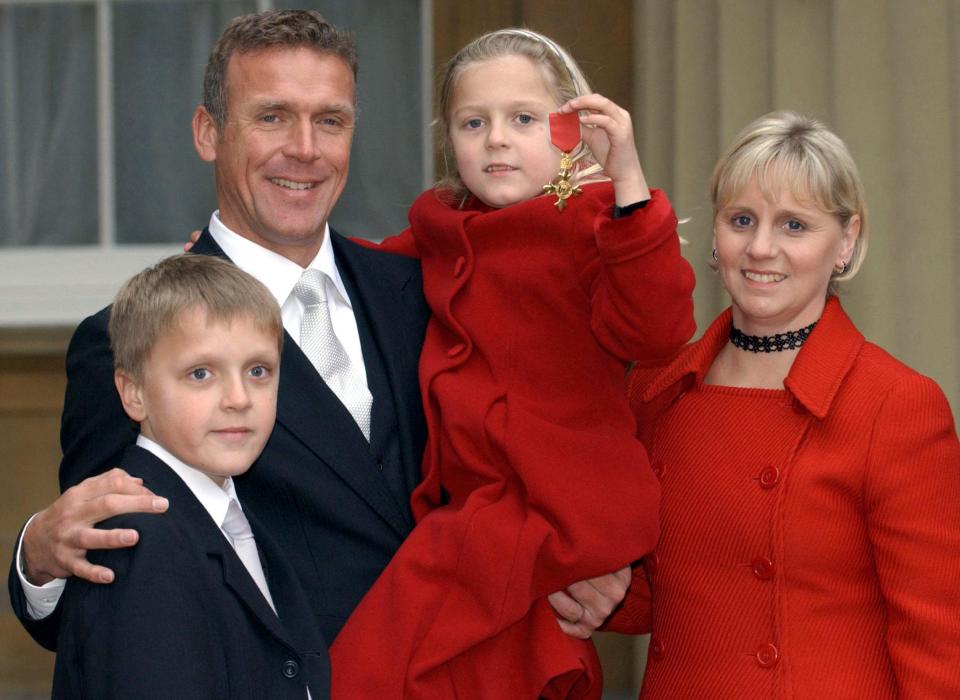 Alec Stewart with his family after receiving an OBE.