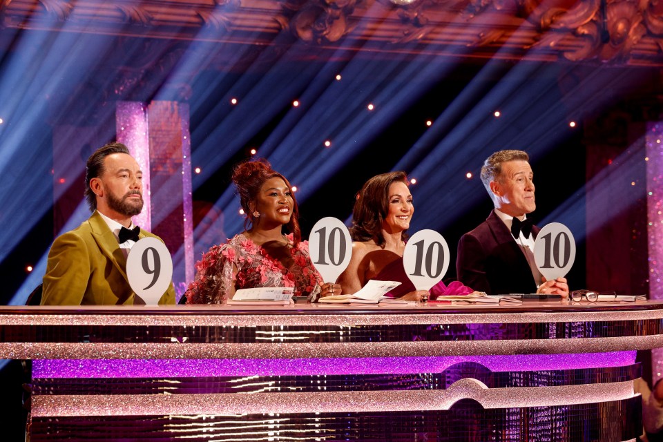 Strictly Come Dancing judges Craig Revel Horwood, Motsi Mabuse, Shirley Ballas, and Anton Du Beke holding score paddles.