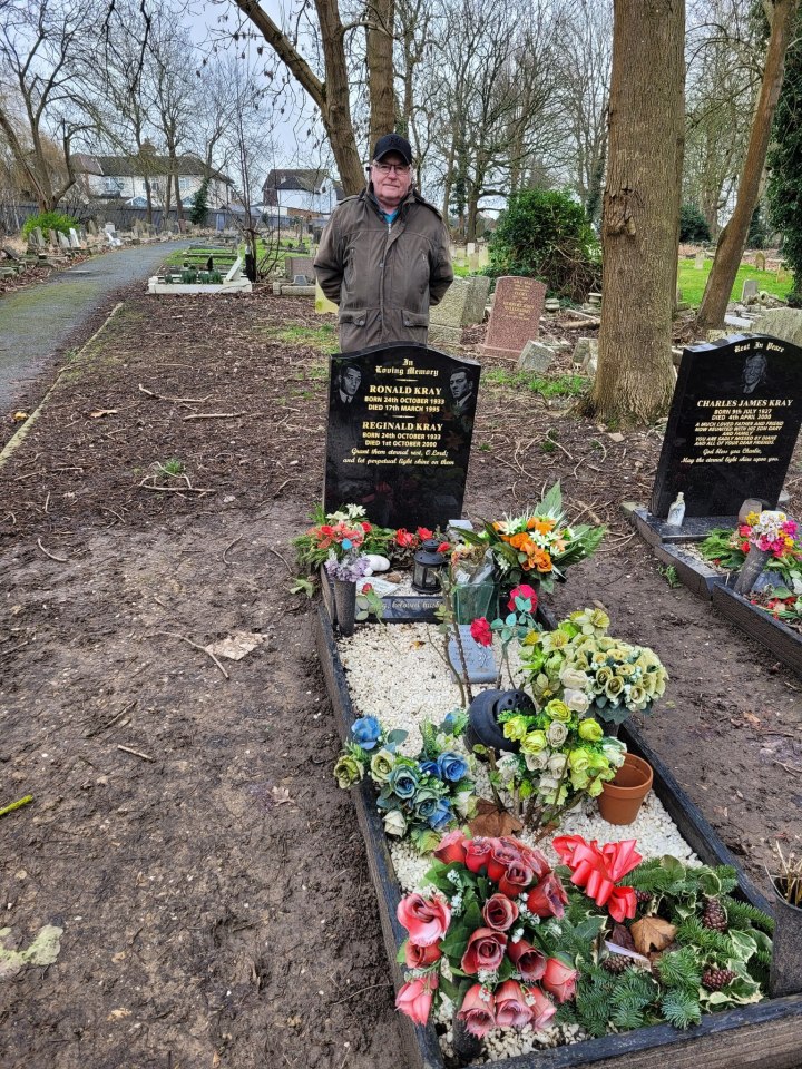Man standing by the Kray twins' graves.