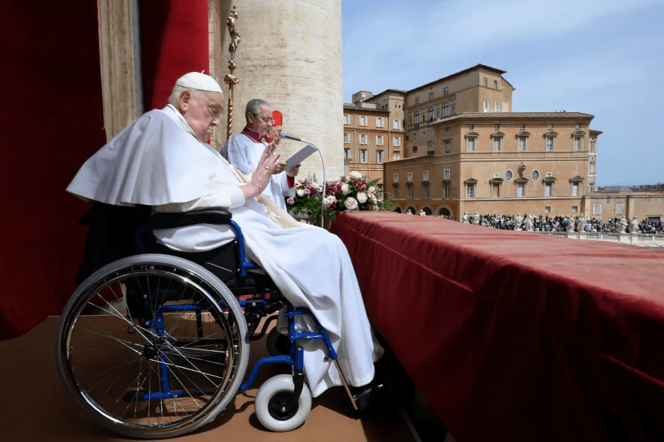 Pope Francis in a wheelchair, giving a speech.