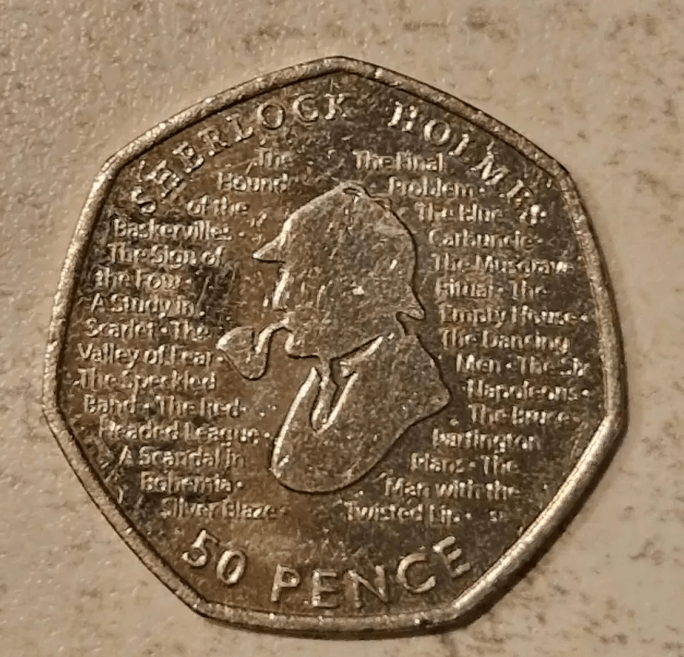 Fifty pence coin featuring Sherlock Holmes and titles of his stories.