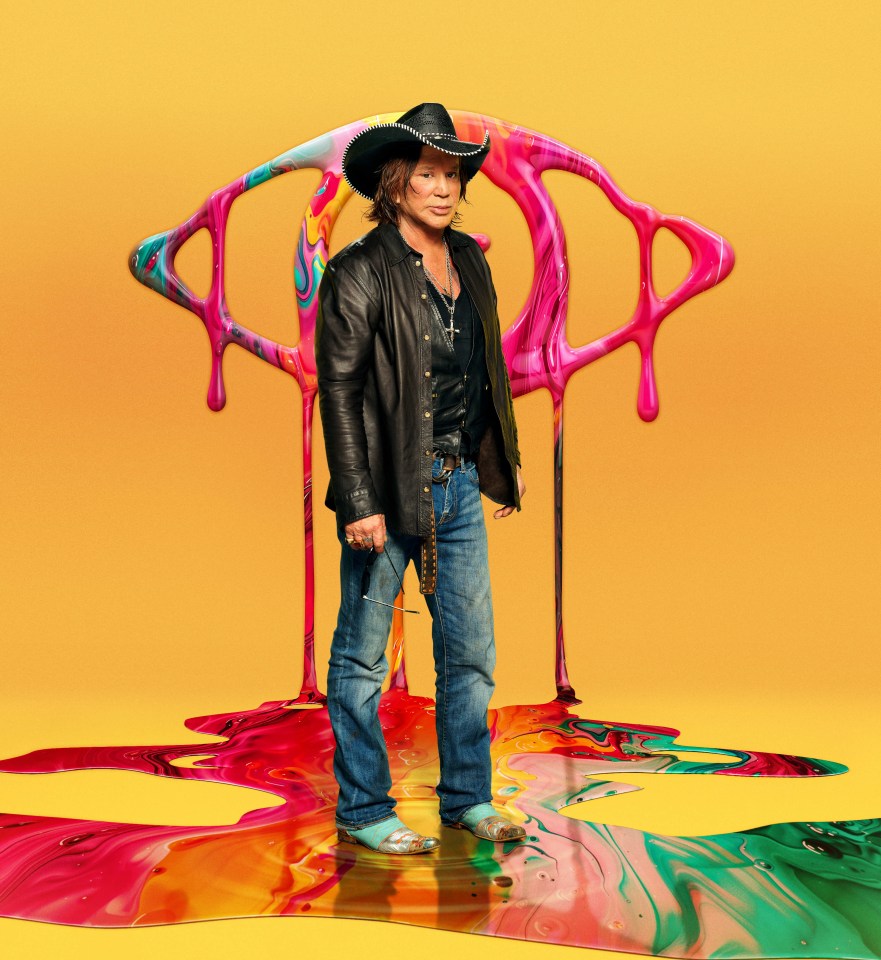 Mickey Rourke standing on colorful paint for Celebrity Big Brother.