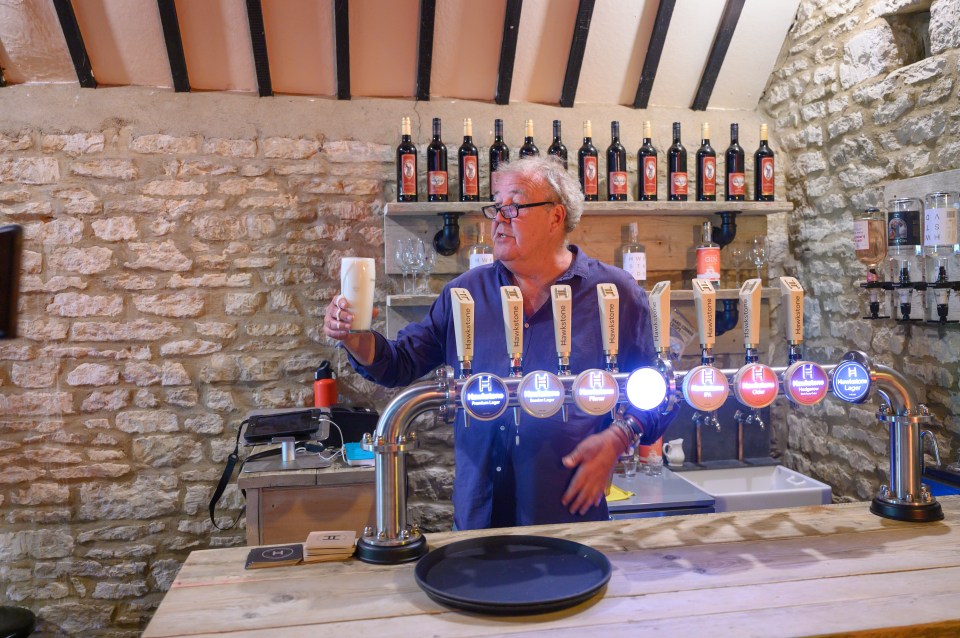 Jeremy Clarkson pouring a pint of beer.