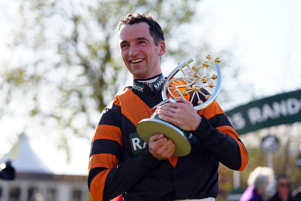 Jockey Patrick Mullins winning a race at Aintree racecourse.