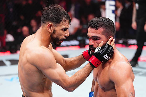 MIAMI, FLORIDA - APRIL 12: (L-R) Yair Rodriguez of Mexico talks with Patricio 'Pitbull' Freire of Brazil after a featherweight bout during the UFC 314 event at Kaseya Center on April 12, 2025 in Miami, Florida. (Photo by Jeff Bottari/Zuffa LLC)