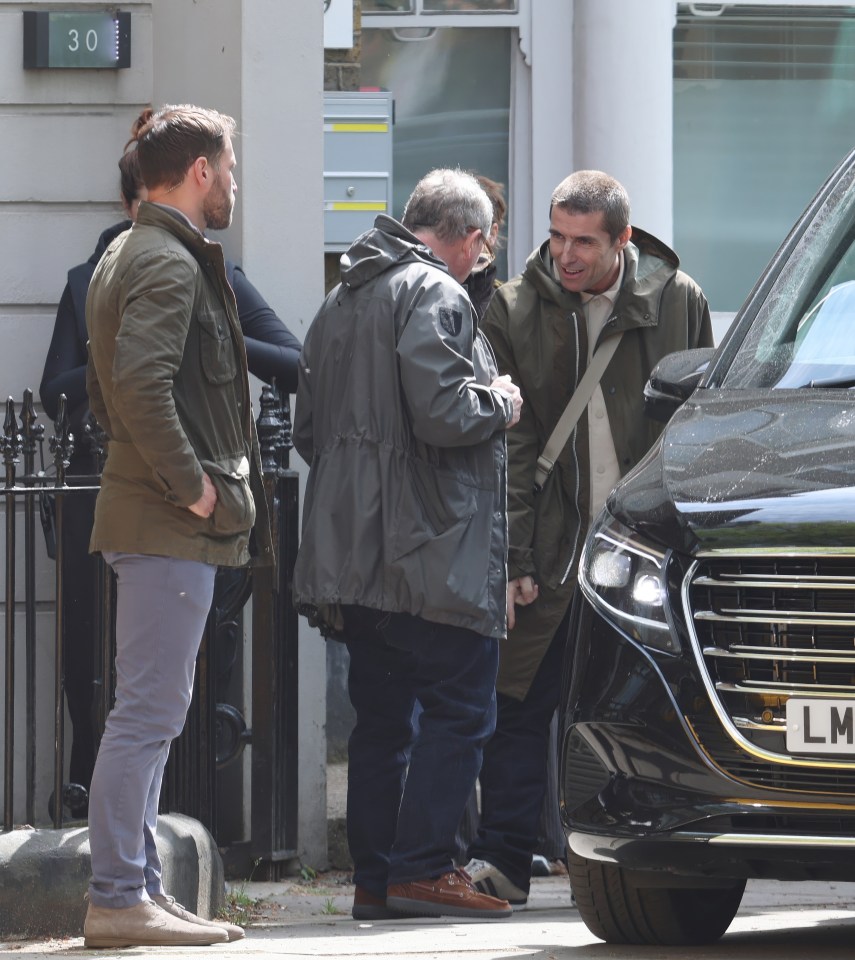 Liam and Noel Gallagher filming a promotional video.