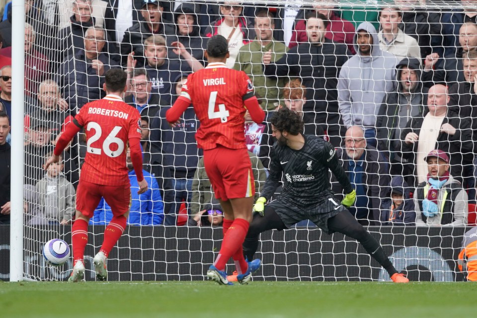 Andrew Robertson scoring an own goal during a Liverpool vs. West Ham United soccer match.