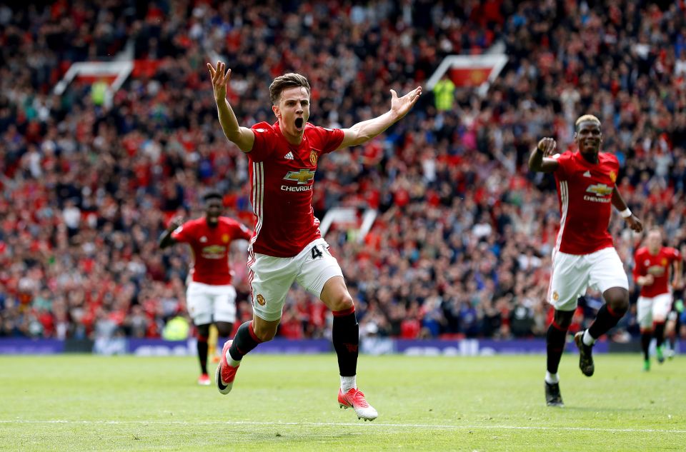 Josh Harrop of Manchester United celebrates scoring a goal.