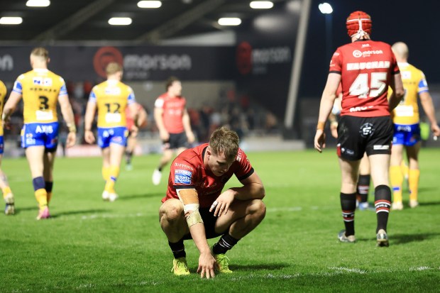 Matty Foster of the Salford Red Devils crouching on the field.