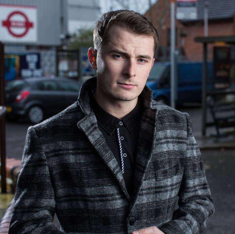 Max Bowden in a gray plaid jacket.