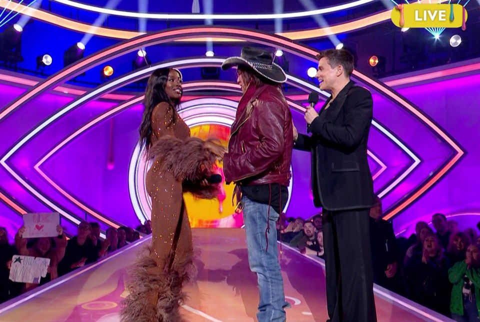 Mickey Rourke and AJ Odudu on a TV show.