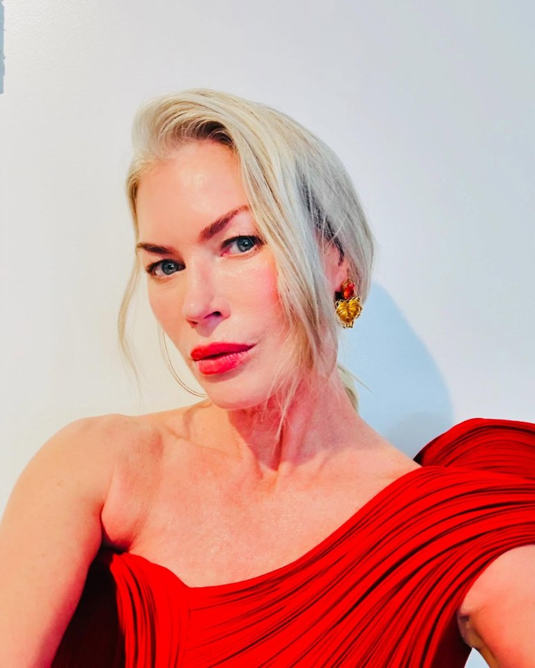 Carré Otis in a red dress.