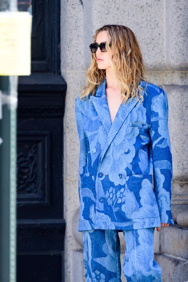 Kai Schreiber Watts in a blue floral denim suit.