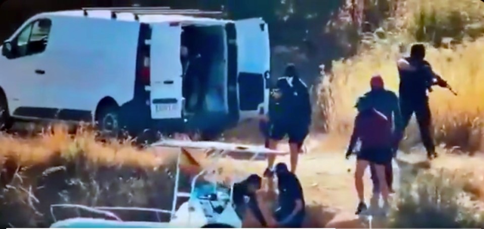 Drug gang members unloading drugs from a boat in Galicia, Spain.