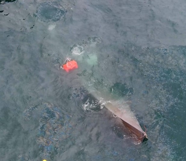 Seized narco-submarine in the water.
