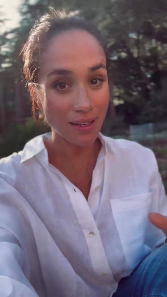 Meghan Markle in a white shirt.