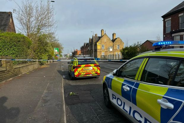 An image collage containing 1 images, Image 1 shows Police cars at a road closure following a serious car accident