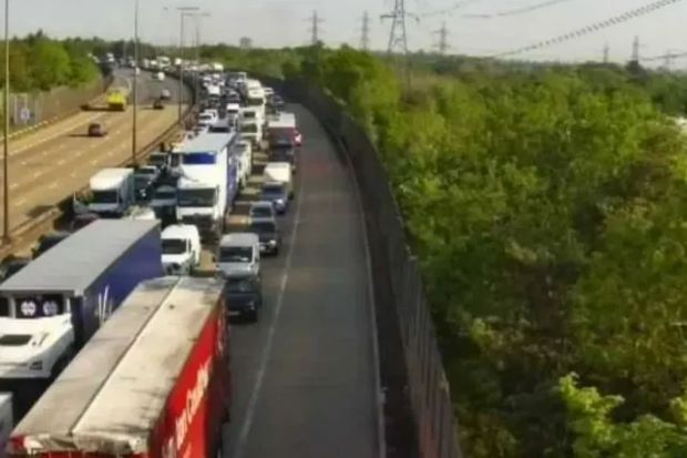 An image collage containing 1 images, Image 1 shows Aerial view of a traffic jam on a highway