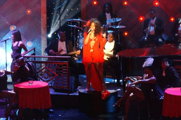 An image collage containing 1 images, Image 1 shows Ashanti performing on stage at the Soul Train Lady of Soul Awards