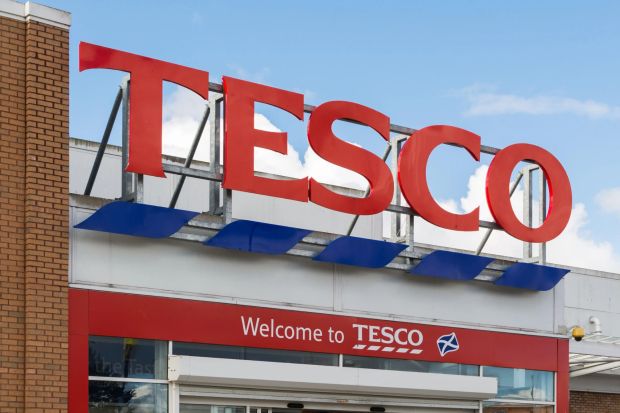 An image collage containing 1 images, Image 1 shows Tesco store sign