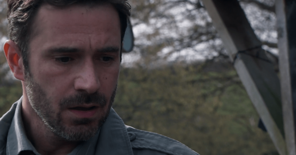Close-up of a man looking concerned.