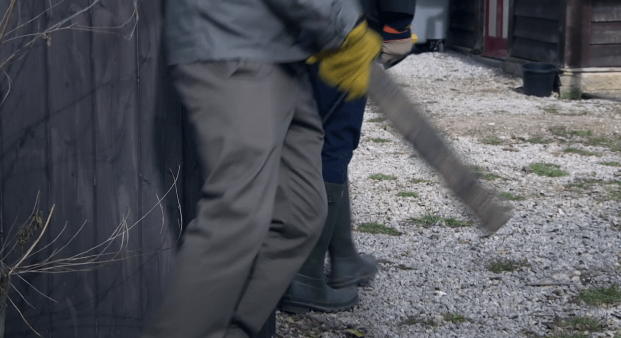 A person being hit on the head from behind.