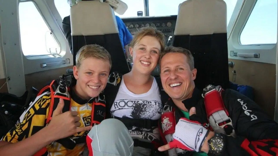 Michael Schumacher and his wife Corinna skiing in the mountains.