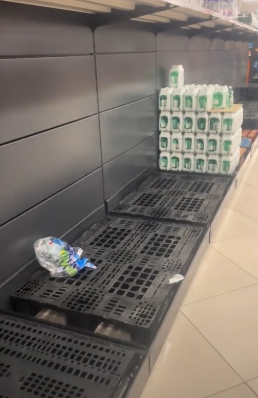 Empty supermarket shelves after a blackout.