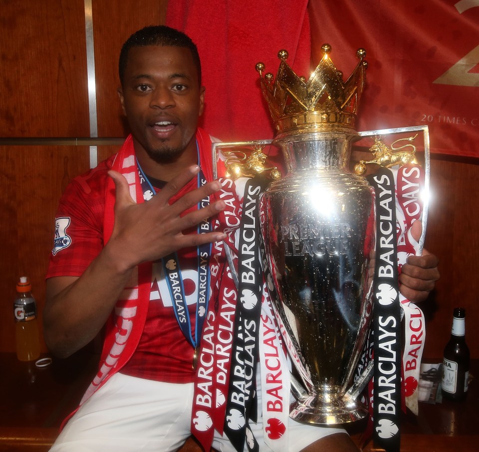 Patrice Evra of Manchester United celebrating with the Barclays Premier League trophy.