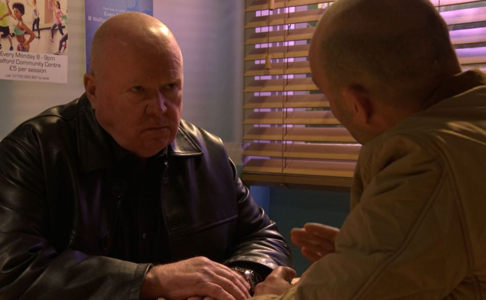 Two men in conversation.